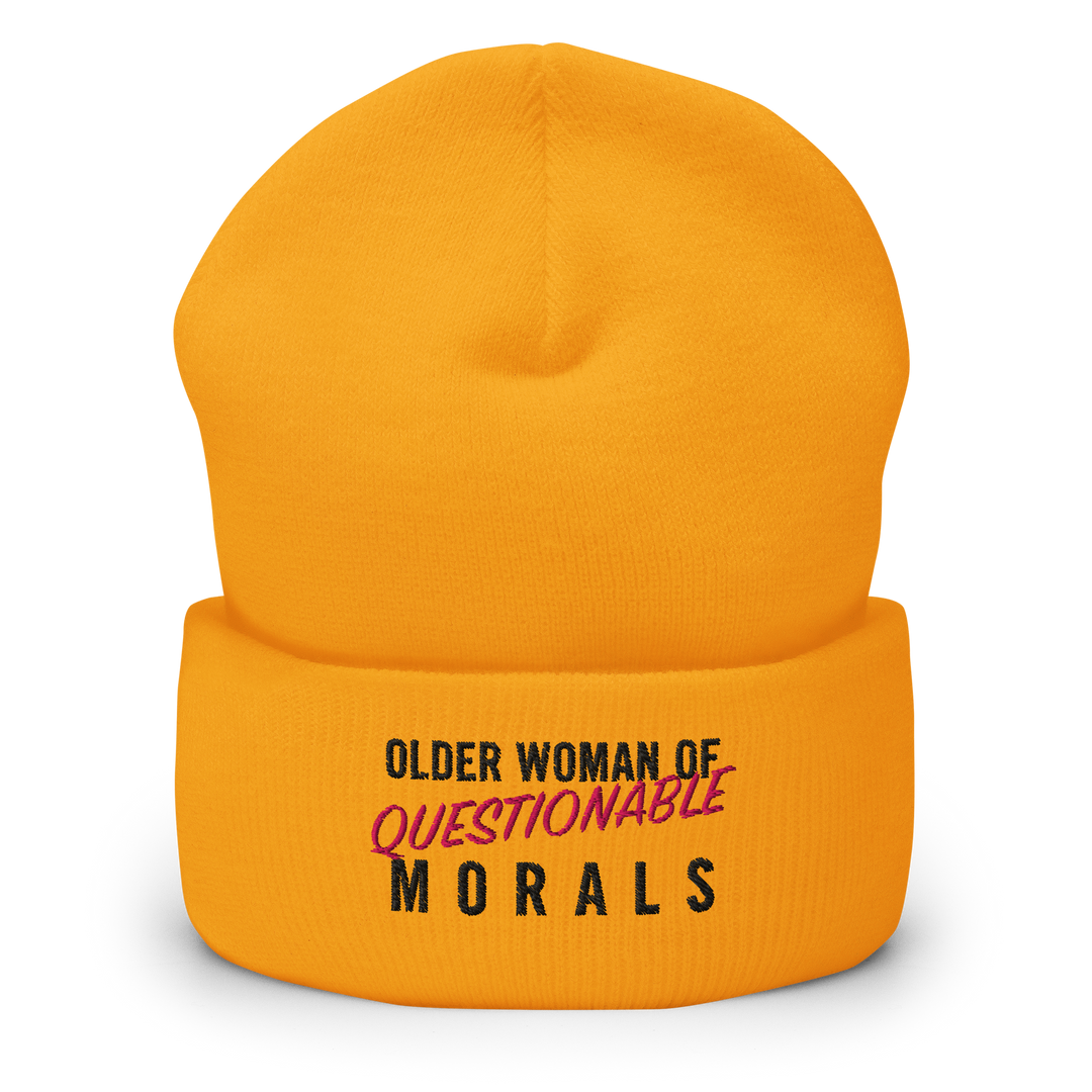 A gold coloured cuffed toque (or beanie) with the words "Older Woman of Questionable Morals" embroidered on the front.